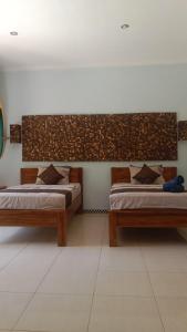 Postel nebo postele na pokoji v ubytování Harris surf villa