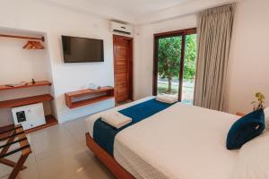 TV a/nebo společenská místnost v ubytování Hotel Ninfa