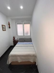 Ένα ή περισσότερα κρεβάτια σε δωμάτιο στο Casa turística Susana