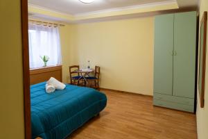 Postel nebo postele na pokoji v ubytování Avernum Relais Hotel e Ristorante