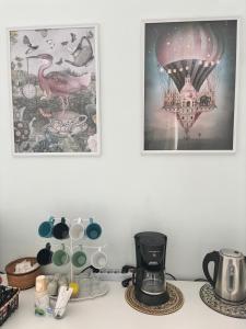 a kitchen counter with a coffee maker and a picture at Il Teatro Rooms in Catania