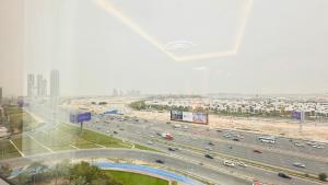 a highway with a lot of traffic in a city at Spacious Studio Apartment Burj View with Balcony Free Parking by Belvilla in Dubai +23 photos