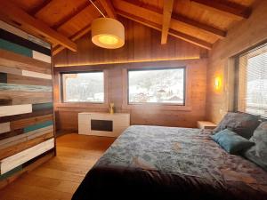 Un pat sau paturi într-o cameră la Les Brimbelles, détente & spa, au cœur des Vosges +36 fotografii