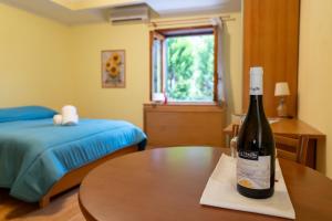 Postel nebo postele na pokoji v ubytování Avernum Relais Hotel e Ristorante