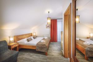 Letto o letti in una camera di Hotel Mikulášska Chata
