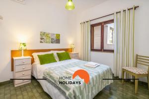 Giường trong phòng chung tại #241 Old Town - Casa de Albufeira 1 by Home Holidays