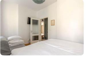 Ένα ή περισσότερα κρεβάτια σε δωμάτιο στο Apartmán l Praha centrum +21 φωτογραφίες