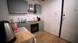Kuchyň nebo kuchyňský kout v ubytování Rovetta Tre Piazze Apartments