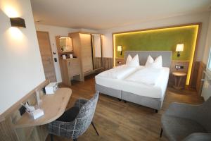 Postel nebo postele na pokoji v ubytování Wohlfühlhotel Bercher