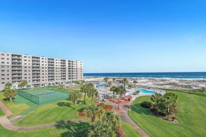 an aerial view of a resort with a tennis court and the ocean at Gulf Shores Plantation-East 3210 in Gulf Shores
