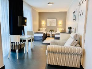 Posezení v ubytování HOTEL Amber Suite & SPA - Enklawa dla Dorosłych + 37 fotografií
