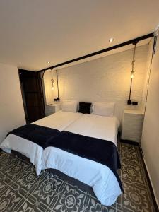 Postel nebo postele na pokoji v ubytování Hotel Quinta Bolivar