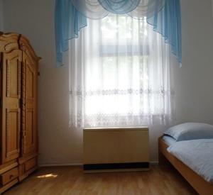 En eller flere senge i et værelse på Apartment Haus Essen