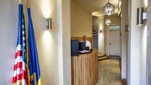 a man sitting at a desk in an office at Rainforest Studio Downtown by Pretty Apartments in Bucharest