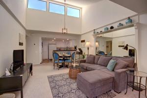 a living room with a couch and a table at Deauville Debonair in Palm Springs
