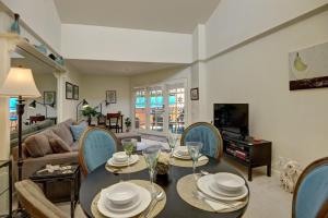 a living room with a table and chairs at Deauville Debonair in Palm Springs +32 photos