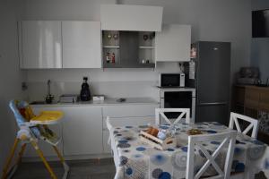 a kitchen with a table with a box of food on it at Casina al mare in Cecina