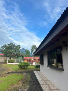 a house with a window on the side of it at Volcano Refuge House in Fortuna +20 photos