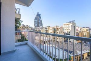 a balcony with a view of a city at BOHO Studio Wanderwood in Mar Mikhael in Beirut