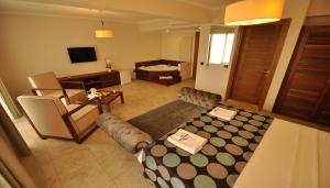 a living room with a couch and a table at Hotel Silvanus in Oren