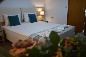 Postel nebo postele na pokoji v ubytování Aqua Mare Sea Side Rooms