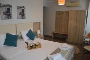 Postel nebo postele na pokoji v ubytování Aqua Mare Sea Side Rooms
