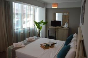 Postel nebo postele na pokoji v ubytování Aqua Mare Sea Side Rooms