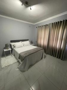 Ένα ή περισσότερα κρεβάτια σε δωμάτιο στο No17 Garden Oasis +7 φωτογραφίες