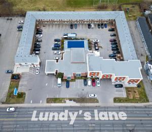 an aerial view of a parking lot with a large building at Niagara Lodge & Suites in Niagara Falls