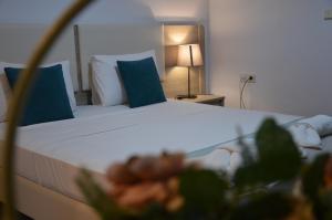 Postel nebo postele na pokoji v ubytování Aqua Mare Sea Side Rooms
