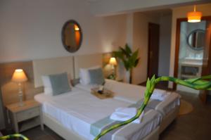 Postel nebo postele na pokoji v ubytování Aqua Mare Sea Side Rooms