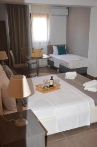 Postel nebo postele na pokoji v ubytování Aqua Mare Sea Side Rooms