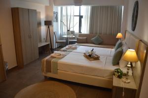 Postel nebo postele na pokoji v ubytování Aqua Mare Sea Side Rooms + 37 fotografií