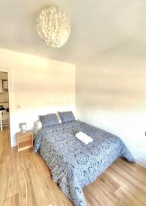 A bed or beds in a room at Apartamento Oasis Mediterráneo