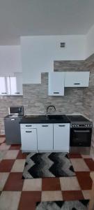 Kuchyň nebo kuchyňský kout v ubytování Apartament 35m2 + 1 fotografie