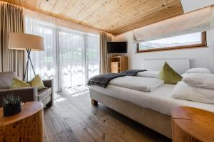 Postel nebo postele na pokoji v ubytování Hotel Stoeres - Active wellbeing