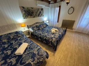 Postel nebo postele na pokoji v ubytování Exclusive Venice Kingsclass