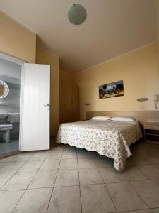 Postel nebo postele na pokoji v ubytování Hotel Giove dipendenza Hotel Fiamma