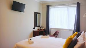 Oban Hotel客房内的一张或多张床位