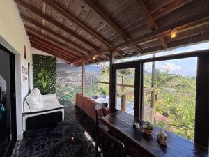 a room with a table and a large window at EDYMA Cabaña con JACUZZI in Guatapé