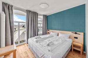 Postel nebo postele na pokoji v ubytování Hotel Friedrichstadt