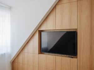 a flat screen tv is mounted on a wall at Pargimaja in Võru