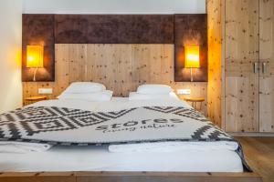 Postel nebo postele na pokoji v ubytování Hotel Stoeres - Active wellbeing