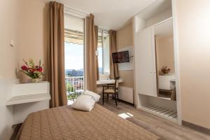 Voodi või voodid majutusasutuse Hotel Abano Astoria toas