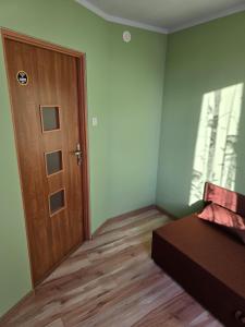 Postel nebo postele na pokoji v ubytování Kwatera27