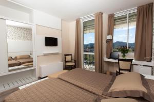 Voodi või voodid majutusasutuse Hotel Abano Astoria toas