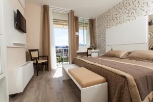 Voodi või voodid majutusasutuse Hotel Abano Astoria toas