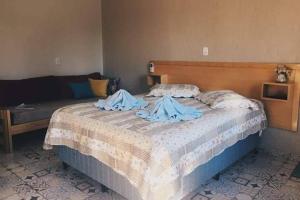 Cama ou camas em um quarto em Espaço Holístico Chalés