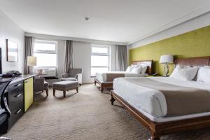 Postel nebo postele na pokoji v ubytování Hotel Champlain