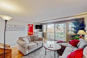 a living room with two couches and a table at Briarcliff G34 in Sugar Mountain